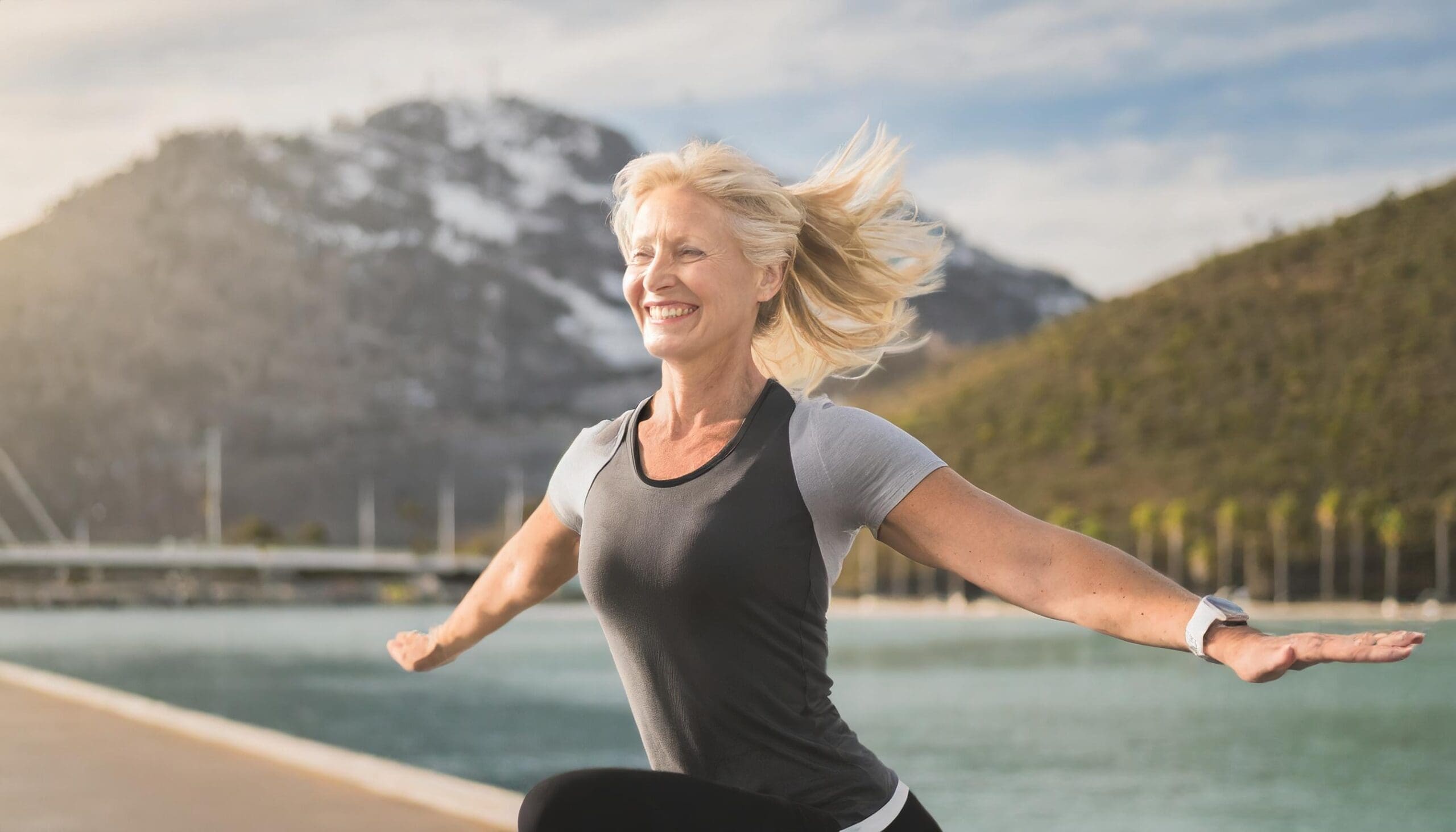 Happy woman celebrating her life-changing journey with CER Bariatrics